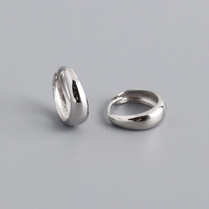 Detail of polished S925 sterling silver hoop earrings with clear hallmark stamp