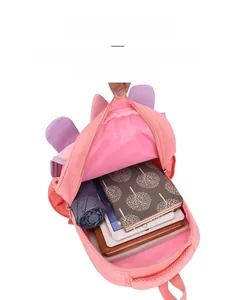 Detail view of the multi-layer interior compartment of this pink cartoon school backpack