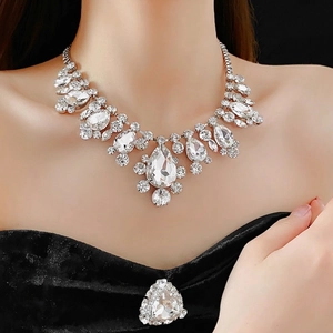 Luxury rhinestone teardrop necklace for women in silver finish on a model wearing black