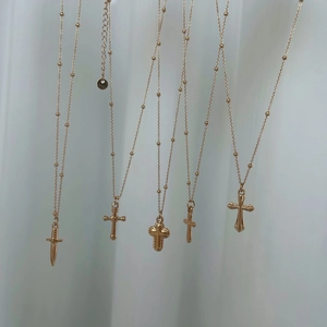 Minimalist gold stainless steel cross and sword pendant necklaces on bead chains