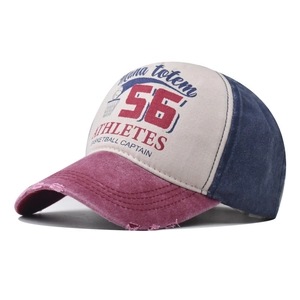 Close-up of vintage washed baseball cap with 56 embroidery and distressed brim details