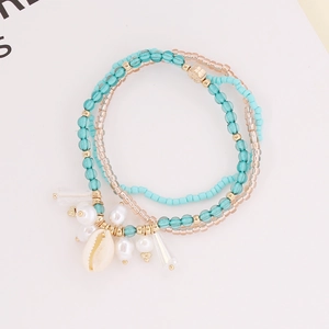 Bohemian multilayer shell bracelet with blue crystal beads and golden metal accents