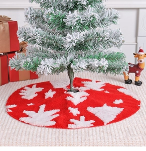 Detail of red plush Christmas tree skirt with white snowflake patterns in a cozy festive setting