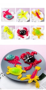 Macro detail of squishy ocean animal stress toys including red crab and yellow starfish