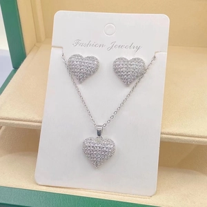 Silver stainless steel jewelry set with pavé crystal heart necklace and matching earrings