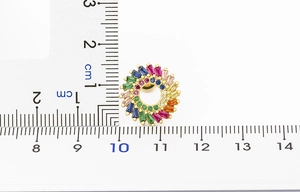 Detailed size measurement of a sunflower earring with rainbow cubic zirconia on a scale