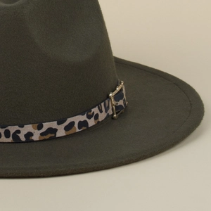 Close-up of dark green wool fedora hat featuring leopard print belt and metal buckle