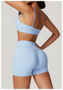 Detail showing high-waist fitness shorts with ruched back design for booty lifting effect