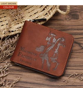 Detail of light brown leather trifold wallet with vintage horse embossing on wood surface