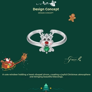 Detail of s925 silver reindeer ring with heart green zircon and festive red nose