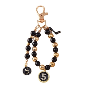 Fashionable beaded keychain with rhinestones number 5 and black high heel charms