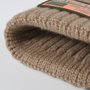 Chic khaki knitted beanie with authentic woven label and thick spiral texture