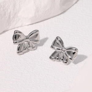 Élégantes boucles d'oreilles nœud en argent en acier inoxydable poli pour femme