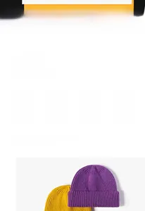 Close-up of thick ribbed knit texture on purple and yellow winter cuffed beanie hats