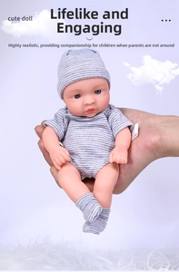 Realistic 20cm reborn baby doll held in hand showing small size and soft texture