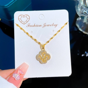 Titanium steel four-leaf clover necklace with pave zircons on white display card