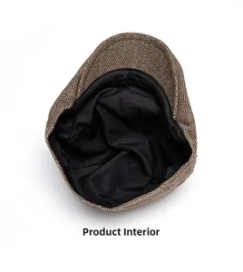 Detail view of the brown herringbone newsboy cap showing internal black fabric lining