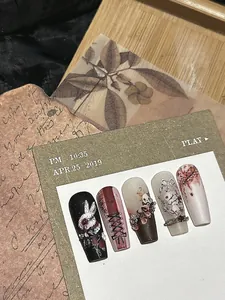Macro view of vintage dark style nail art with bunny patterns and embossed flower details