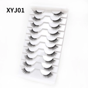 Close-up of 10 pairs natural cat-eye false eyelashes XYJ01 on a white display tray