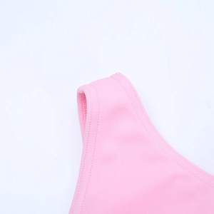 Detail of pink dress shoulder strap showing high-quality double-needle stitching and fabric