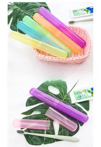 Macro detail of portable translucent macaron colored travel toothbrush and toothpaste cases