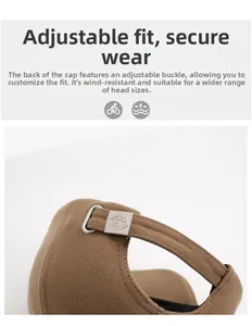 Detail of adjustable metal buckle on brown twill baseball cap for custom fit and windproof use