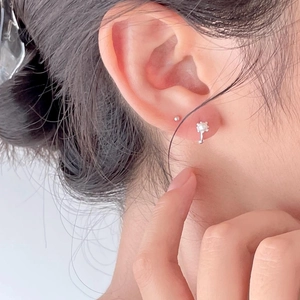 Elegant 925 sterling silver pearl stud earrings set shown on model in close-up view