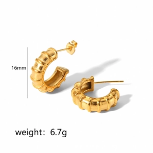 Detail view of 16mm gold ribbed spring hoop earrings with 6.7g weight specification