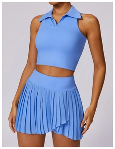 Detail of light blue pleated sports skirt and sleeveless polo top for tennis and golf