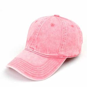 Close-up of pink acid wash denim baseball cap showing six-panel stitch and curved brim