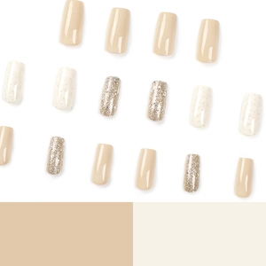 French square press-on nails set in matte nude pink, beige stone, and silver glitter finish