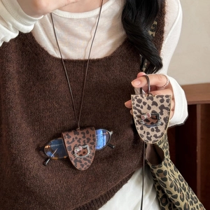 Leopard print leather glasses holder necklace featuring a cute cartoon cat pendant charm