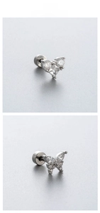Detail view of surgical steel heart and butterfly cartilage studs with zircon stones