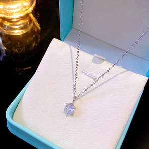 Elegant silver 6-prong solitaire zircon necklace displayed in a premium light blue jewelry box