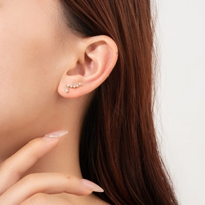 Elegant S925 sterling silver stud earrings with wavy zircon stones for a minimalist look