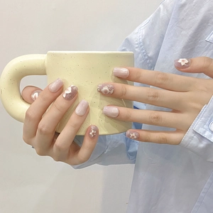 Handmade press-on nails featuring purple cat eye gradient with 3D floral accents