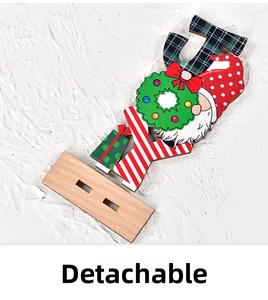 Detail of detachable JOY Christmas wooden gnome sign with red polka dot hat and base