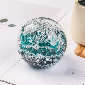 Macro view of blue ocean wave patterns inside a luxury crystal glass ball sculpture