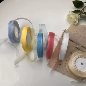 Macro shot of colorful 2cm transparent organza ribbons for gift wrapping and DIY crafts