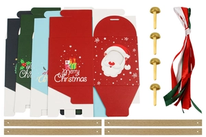 Flat lay of Christmas gift box set with festive ribbons, gold fasteners and paper textures