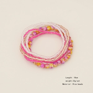 Detail of bohemian seed bead bracelet set in pink and white with size and weight info
