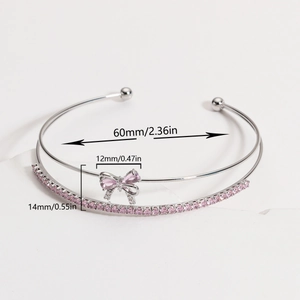 Elegant silver-plated bow bracelet with pink zircon stones and double-layered design