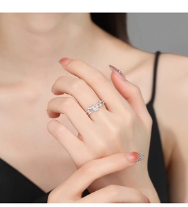 Detailed close-up of a 925 sterling silver butterfly ring with sparkling zircon stones