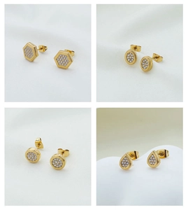 Detail of four geometric gold plated earrings with micro-inlaid cubic zirconia stones