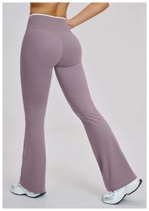 Rear view detail of high-waisted mauve flare yoga pants showing slim fit and back design