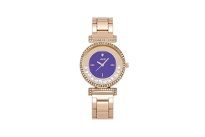 Detailed macro shot of rose gold watch bezel with purple dial and encrusted crystals