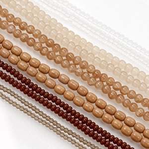 Assortimento di perle in vetro finto giada tonde e ovali per gioielli fai da te toni marroni