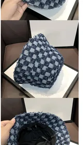 Detailed view of 100% cotton checkered bucket hat showing stitching and inner fabric label