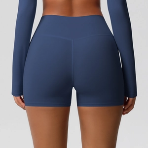 Detail view of high-waisted navy blue yoga shorts showing seamless flatlock stitching