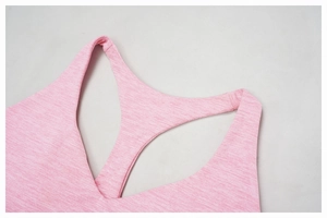 Detailed close-up of racerback design and stitching on pink heathered sports bra